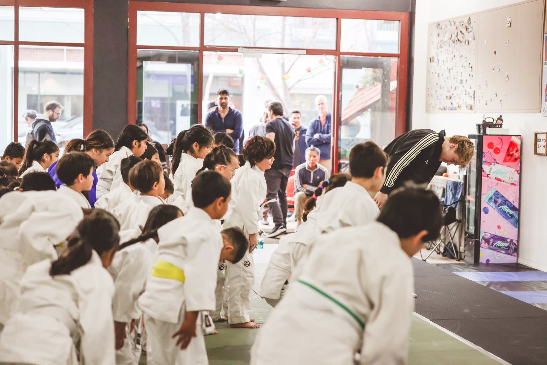 A young Kensei student proudly showing her medal after class
