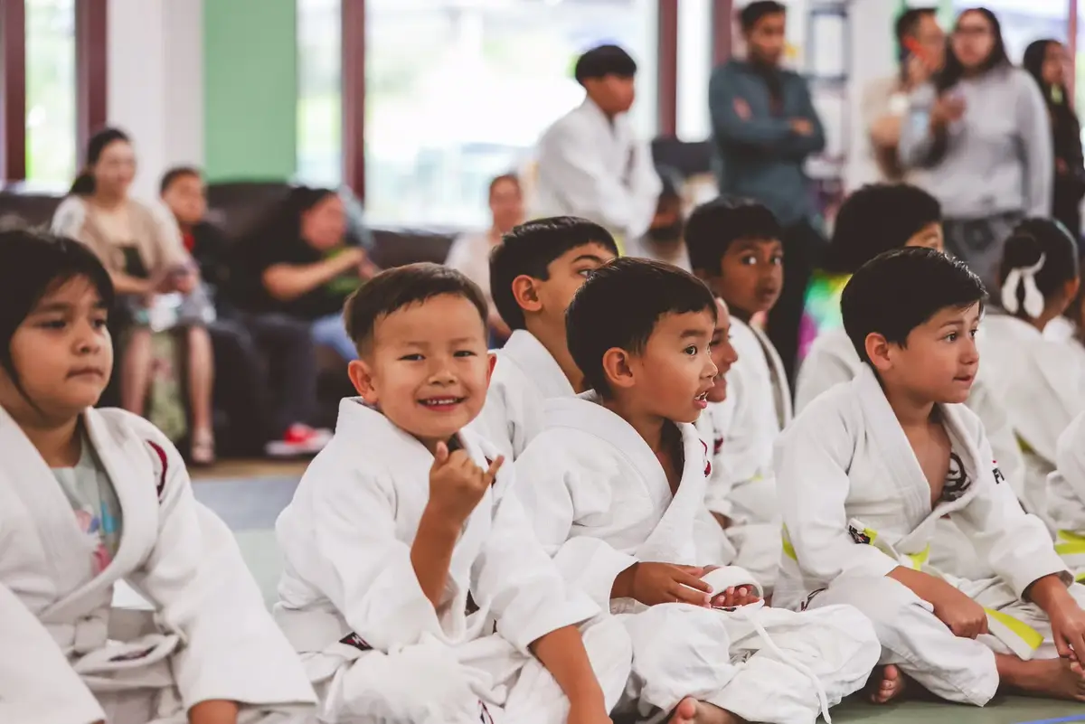 Young Kensei students smiling together after training