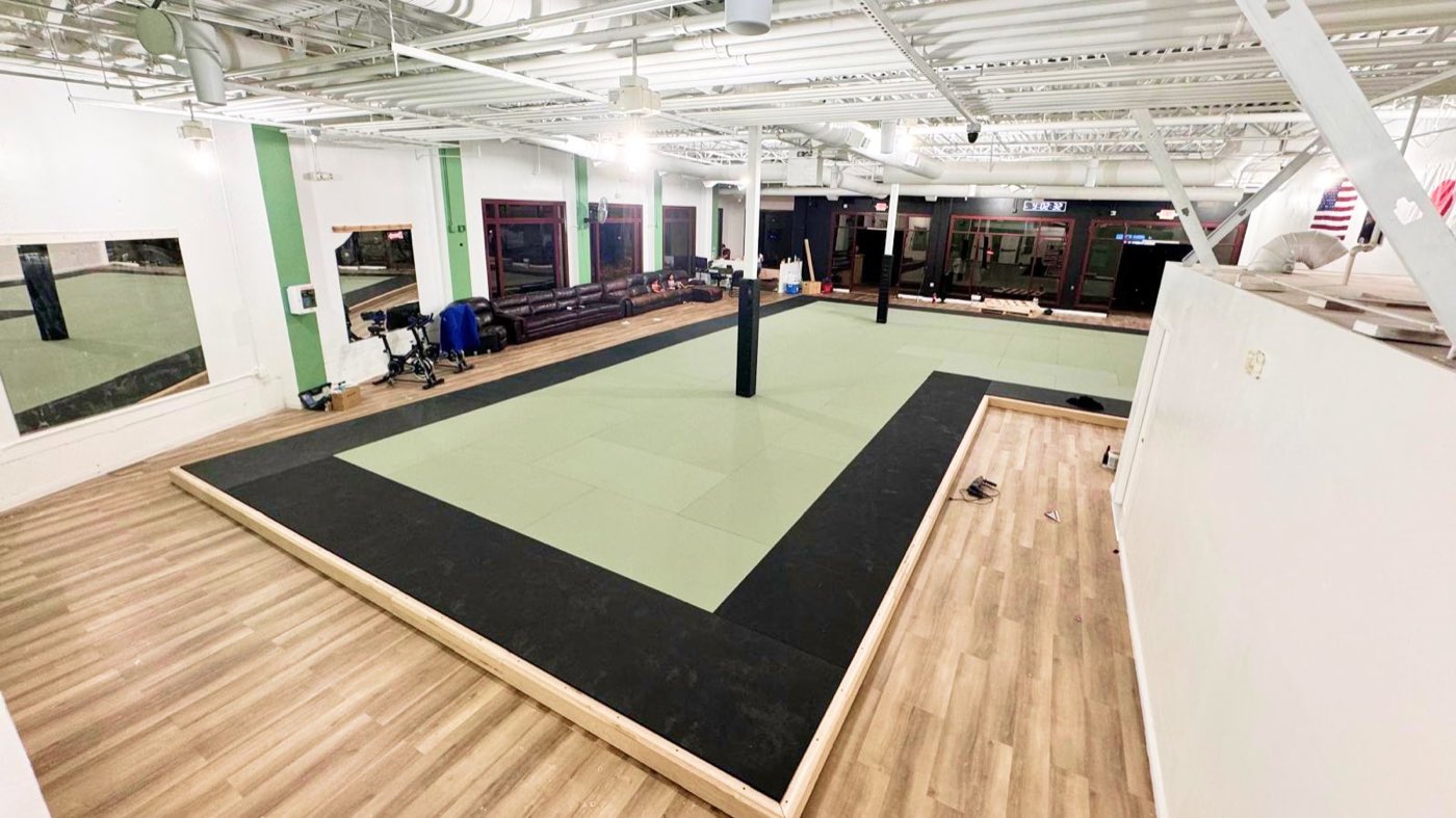 Main practice area with spring-supported mat system