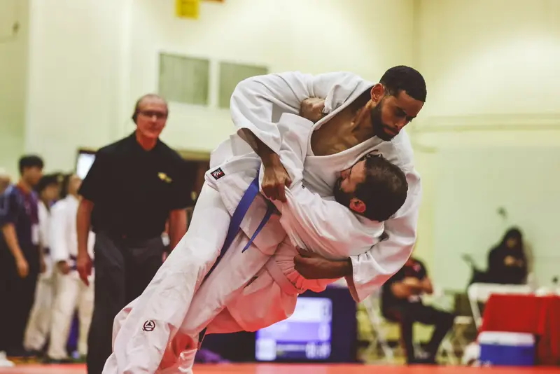 Adult Kensei students practicing a technical judo throw