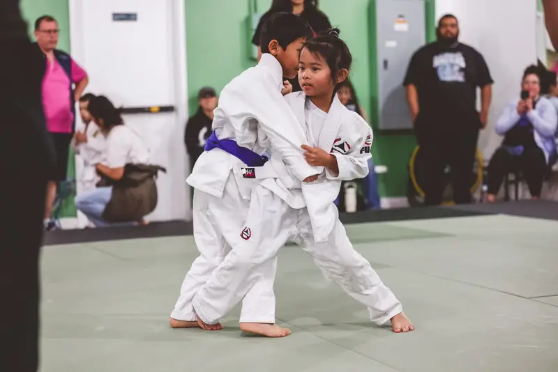 Young Kensei students practicing judo together